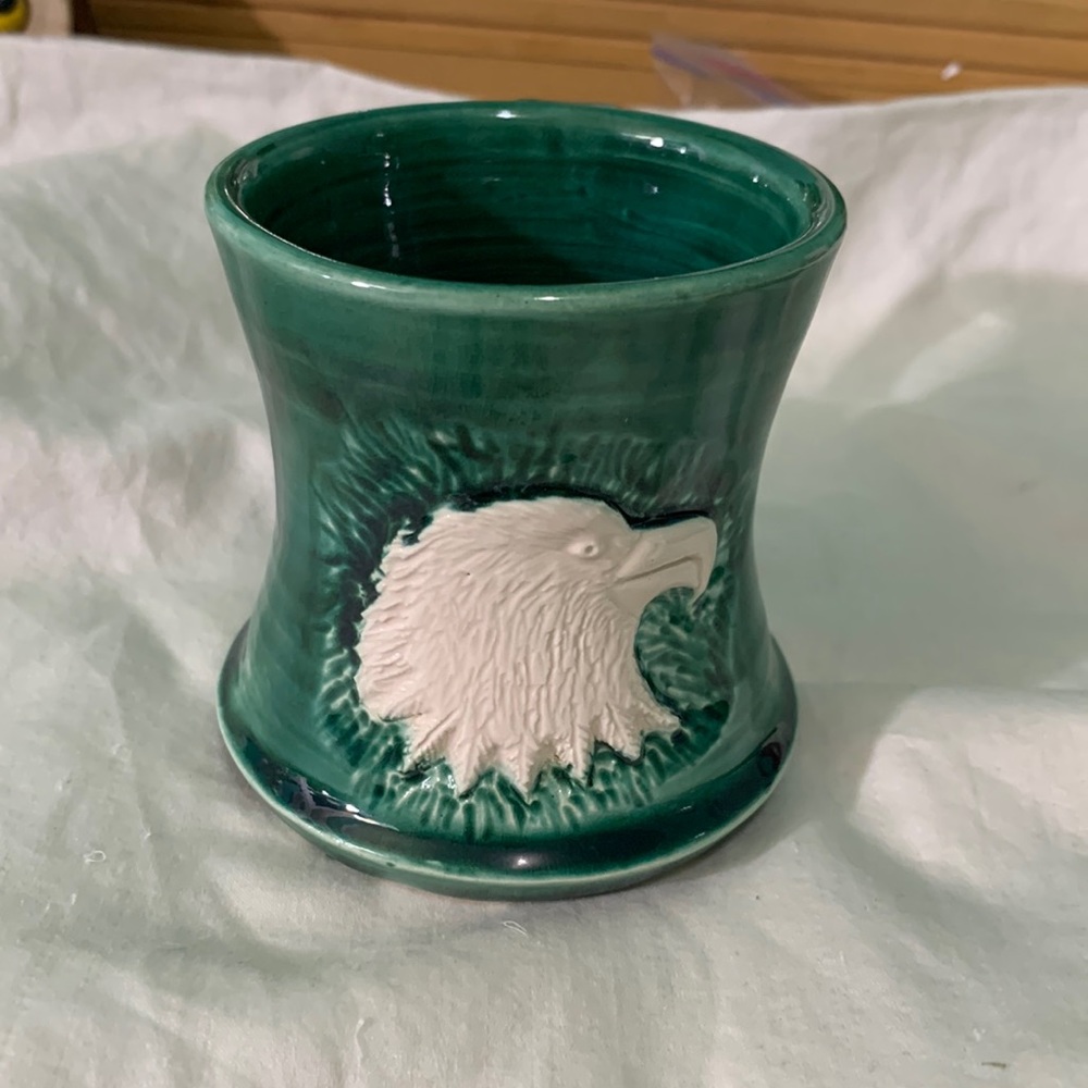 Handmade ceramic green mug with eagle on side